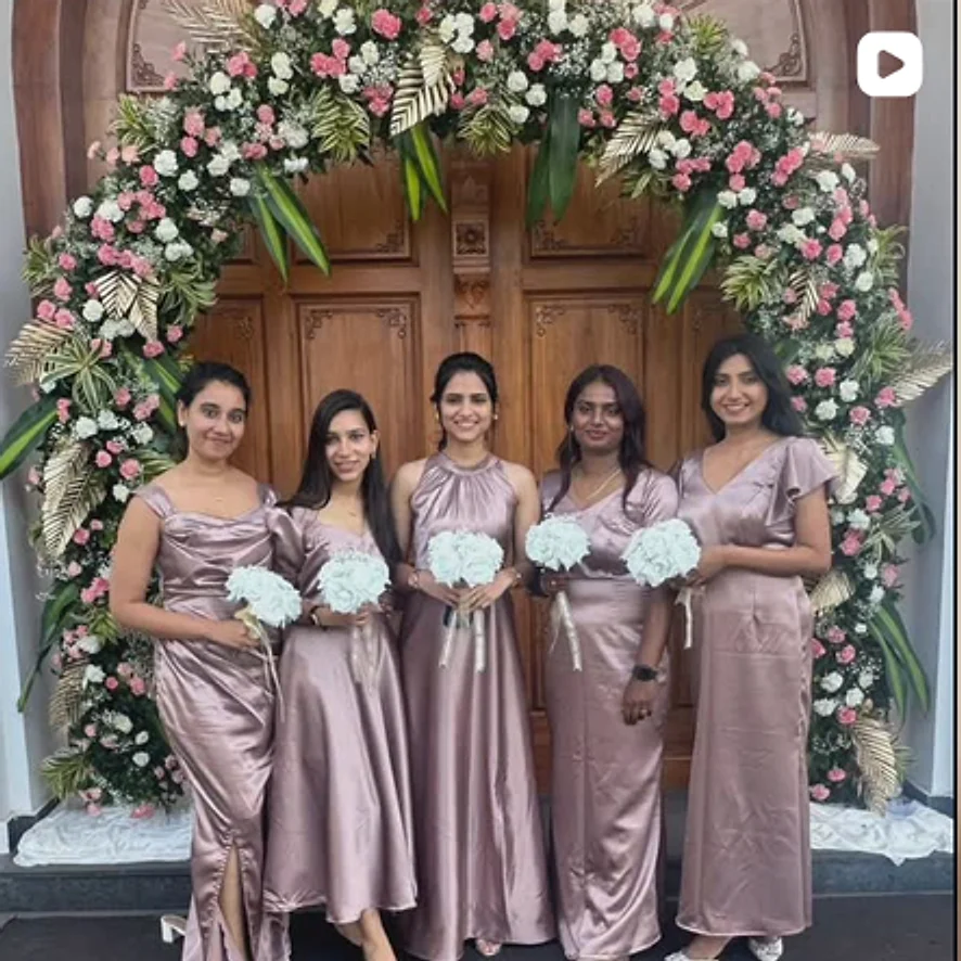 Five bridesmaids in satin gowns